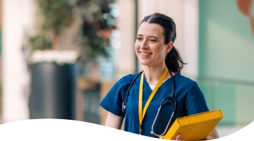 A nurse with a stethoscope around her neck is holding a yellow folder